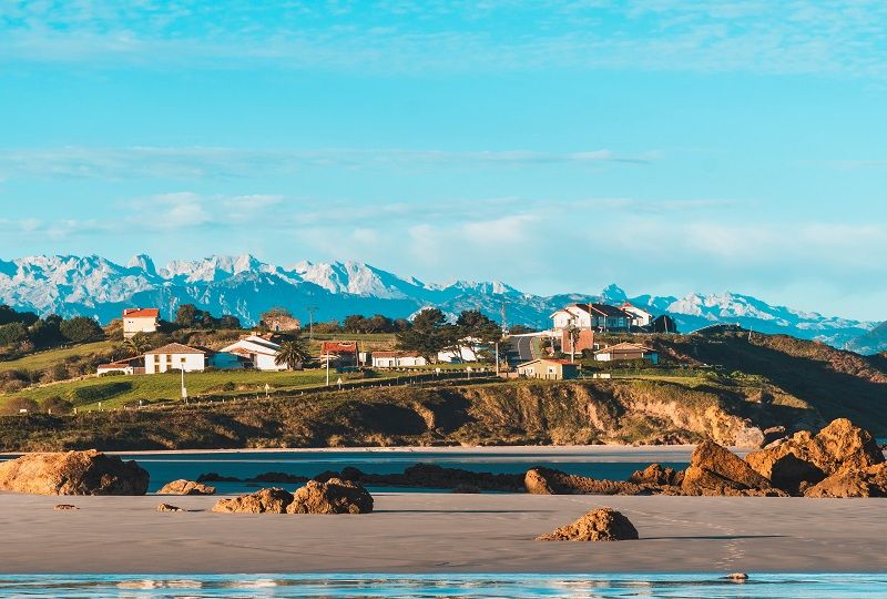 Italian seaside village with mountains in the background