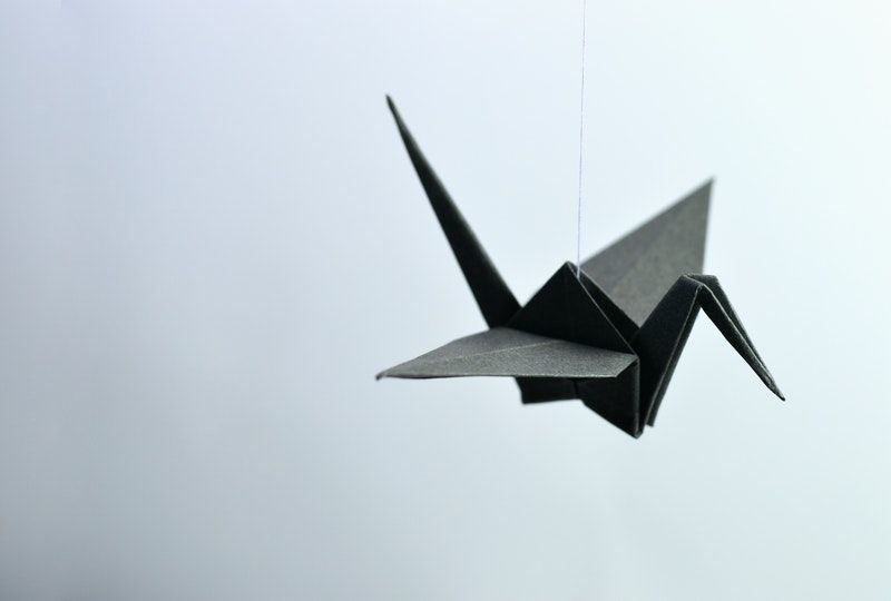 paper crane on a string