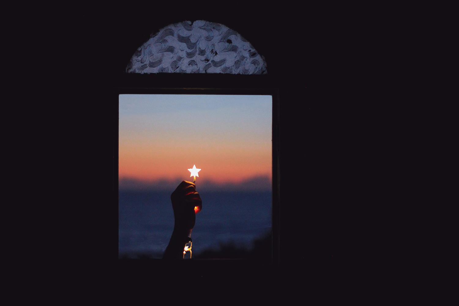 Star in a Window Held By a Hand