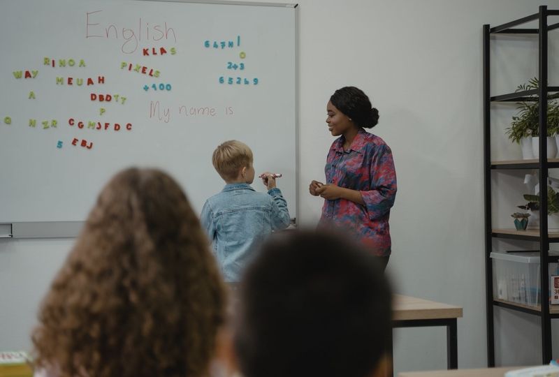 Teacher in school with student