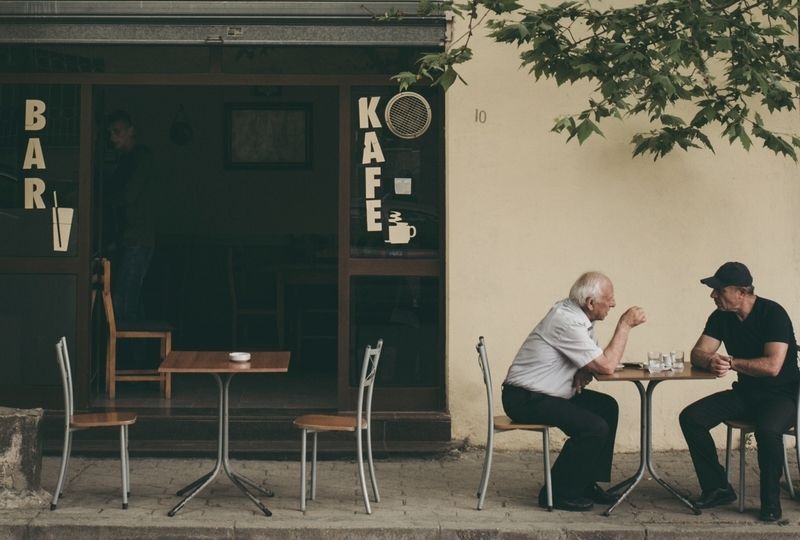 Two Men Were Chatting Outside a Bar