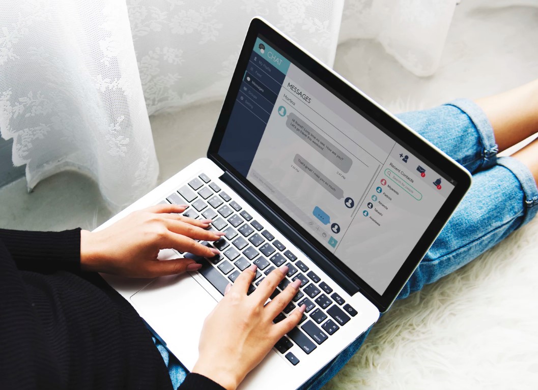 using messaging app on a laptop