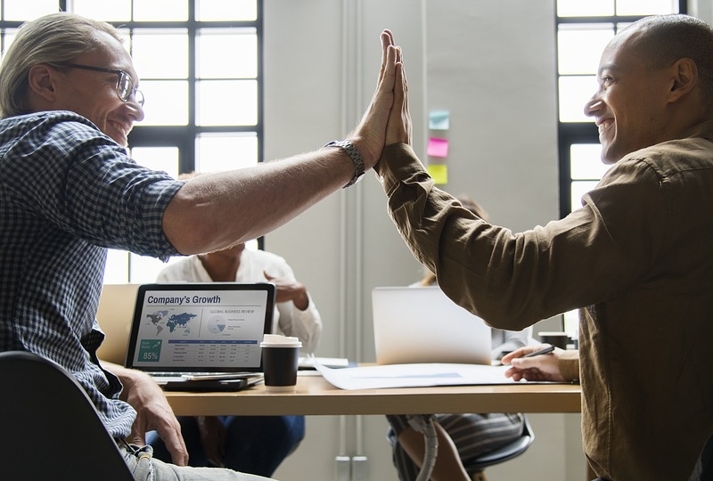 High Five at a meeting