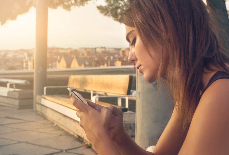 Young woman looking at a cellphone