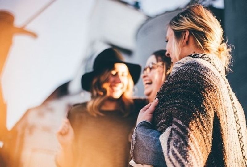 women talking at train