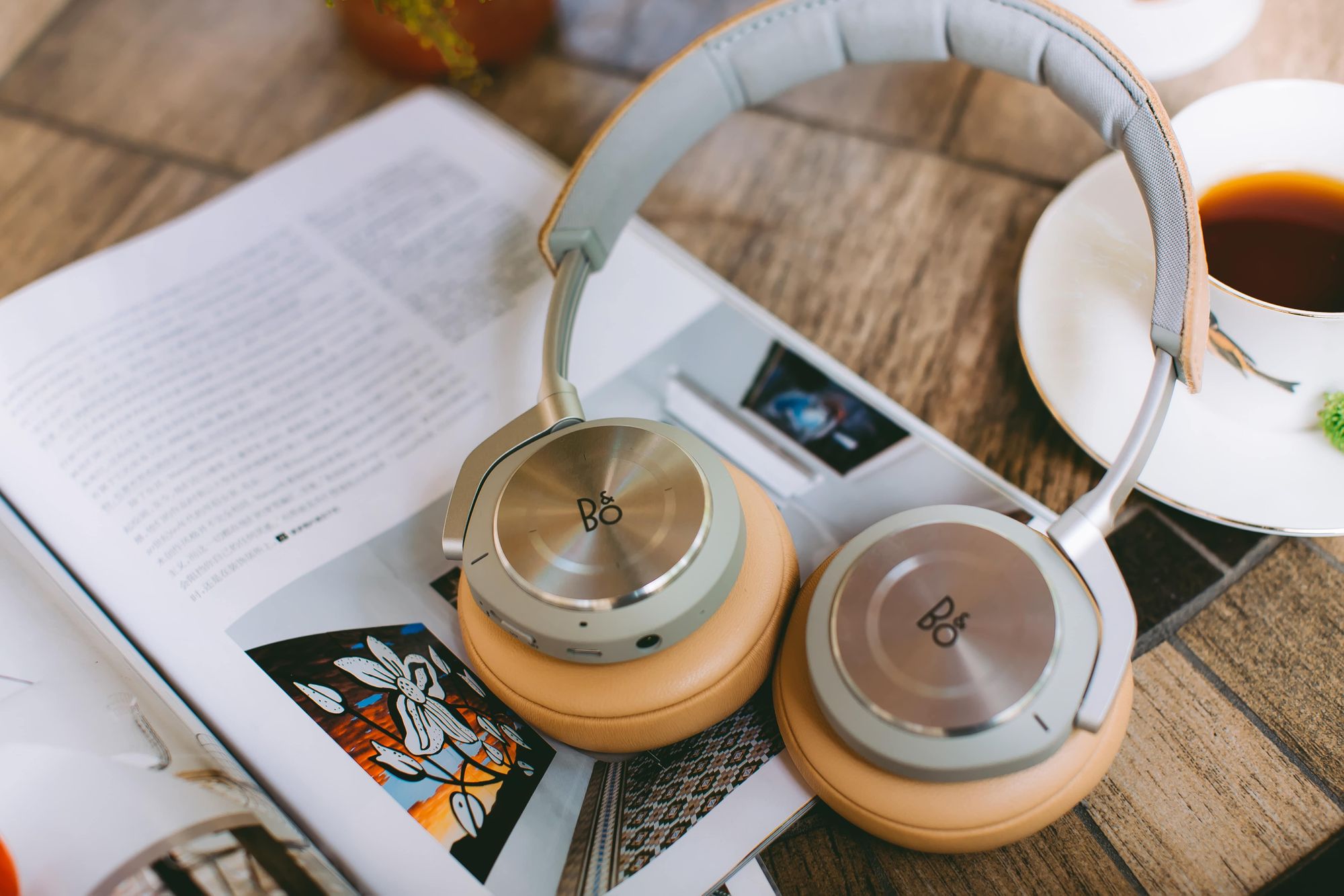 Book, headphones, and a coffee cup